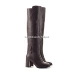 Tall women’s autumn winter boots above the knee. They are standing in the studio on a white background. Boots with zippers. Color is blue. The material is leather