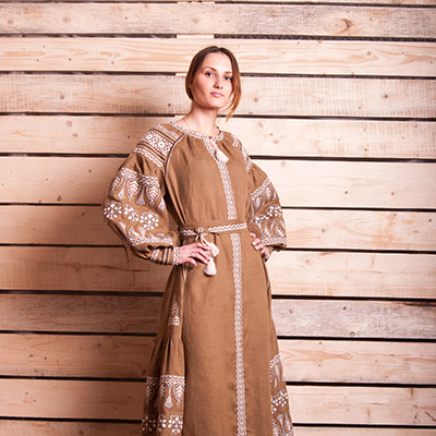 Ukrainian embroidered female folk costume background wood